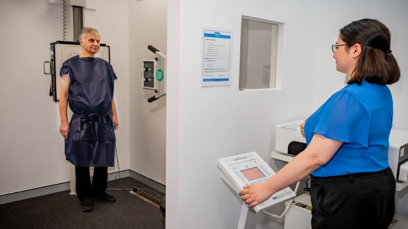 Dr. Chana conducting Xray to a patient